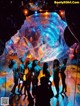 A group of naked women standing in front of a large bubble.