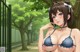 Anime girl in a blue bikini posing in a park.